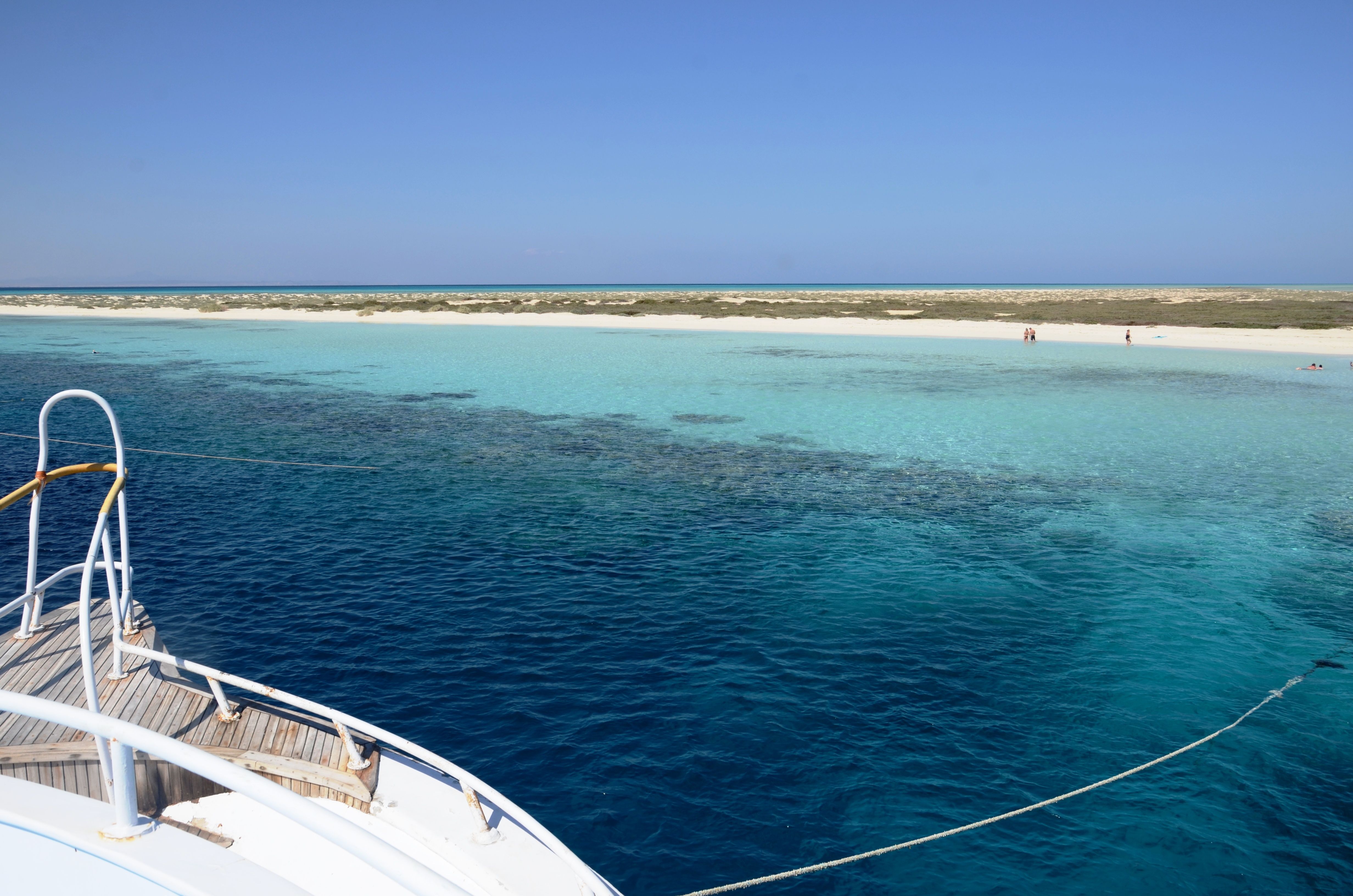 White yacht moored at Hamata island dive site in Egypt.