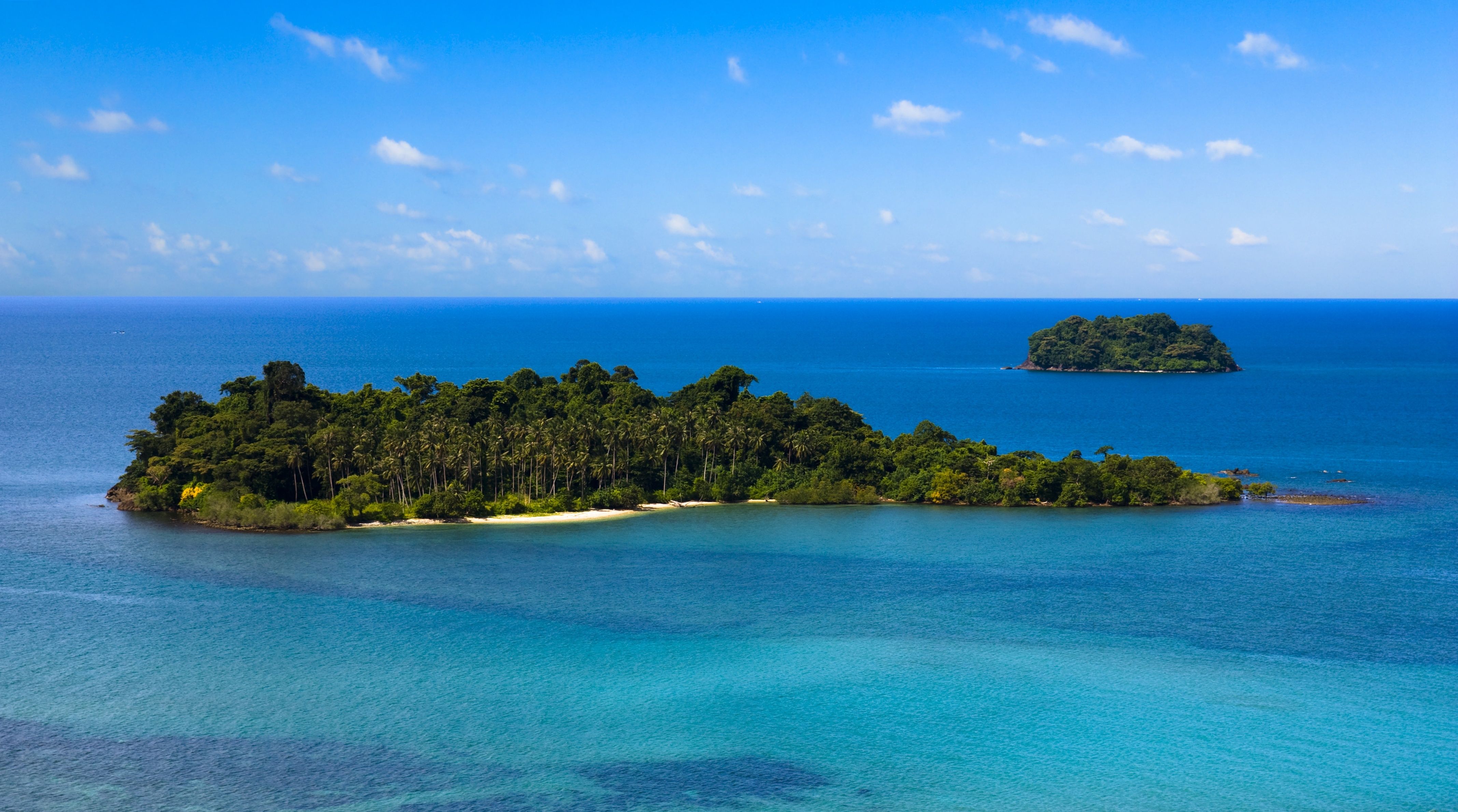 Panorama view of two small tropical islands in clear blue waters in Trat, Thailand. 