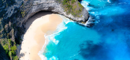 Aerial view of Nusa Penida (T-Rex  Head Beach), with golden sand and tropical water in Bali Indonesia.