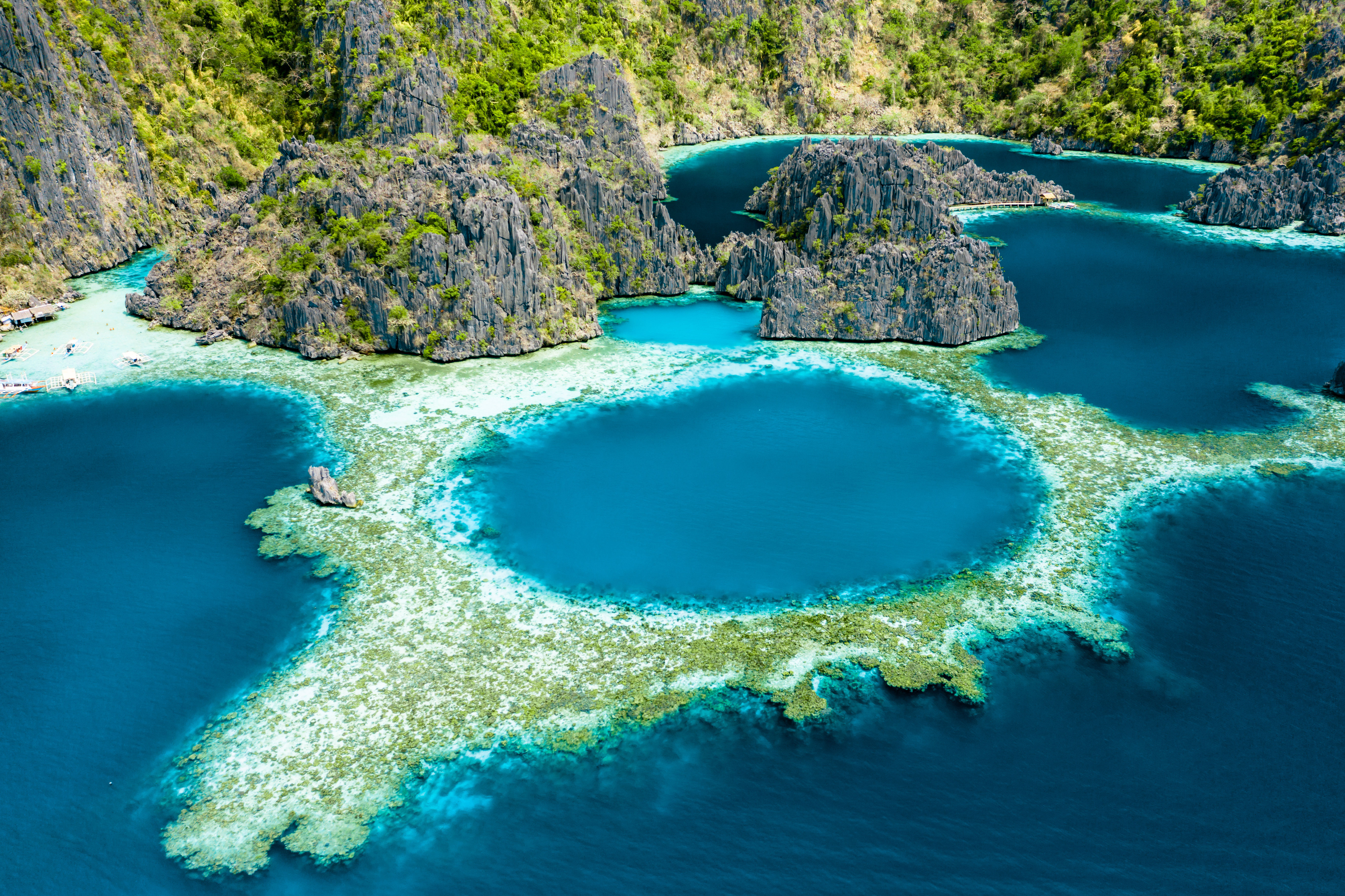 Aerial drone view of limestone cliff, lagoons and reefs at Coron Island, Palawan, Philippines.