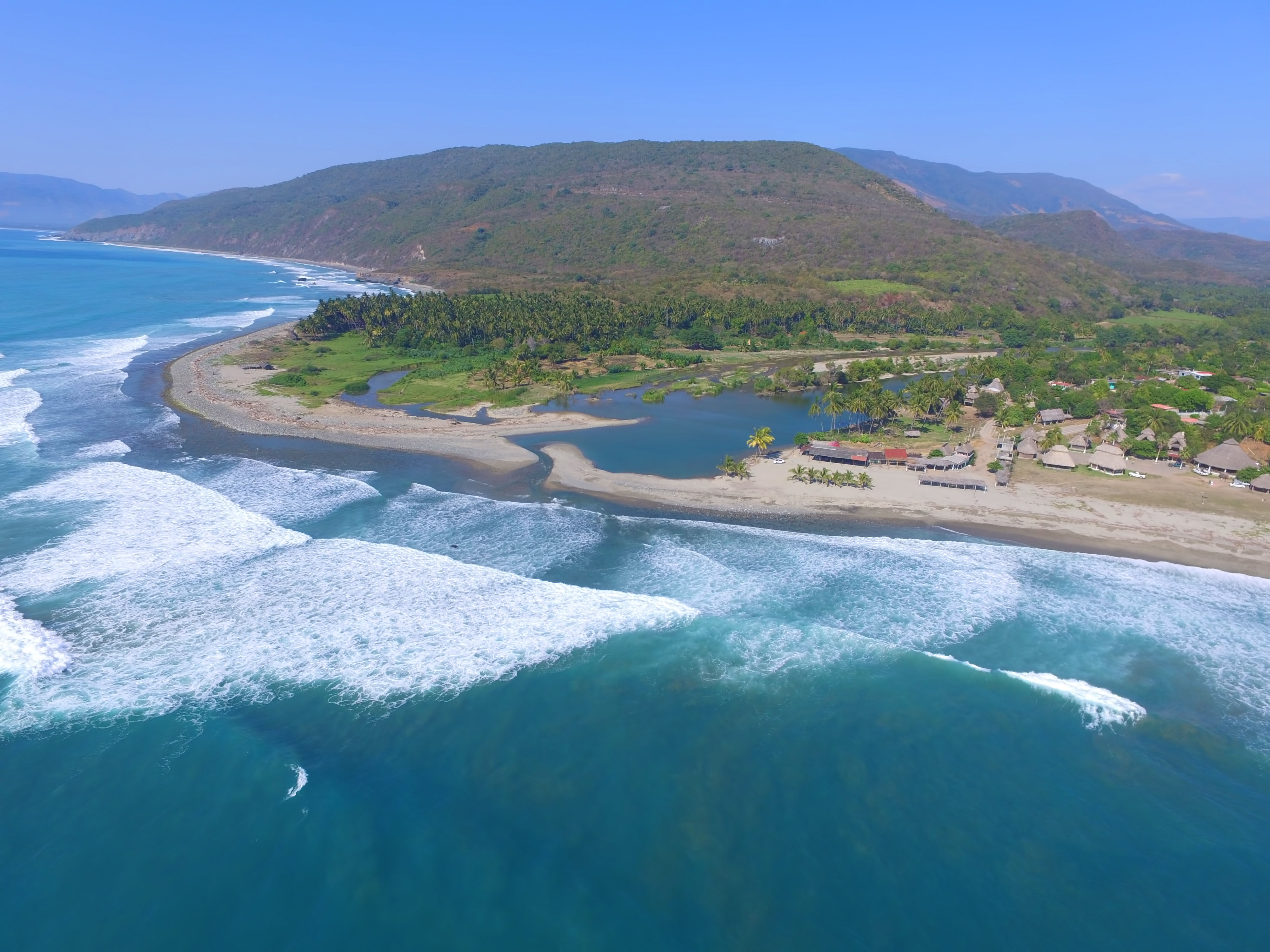 Aerial view of beach with waves in Colima in Mexico. 