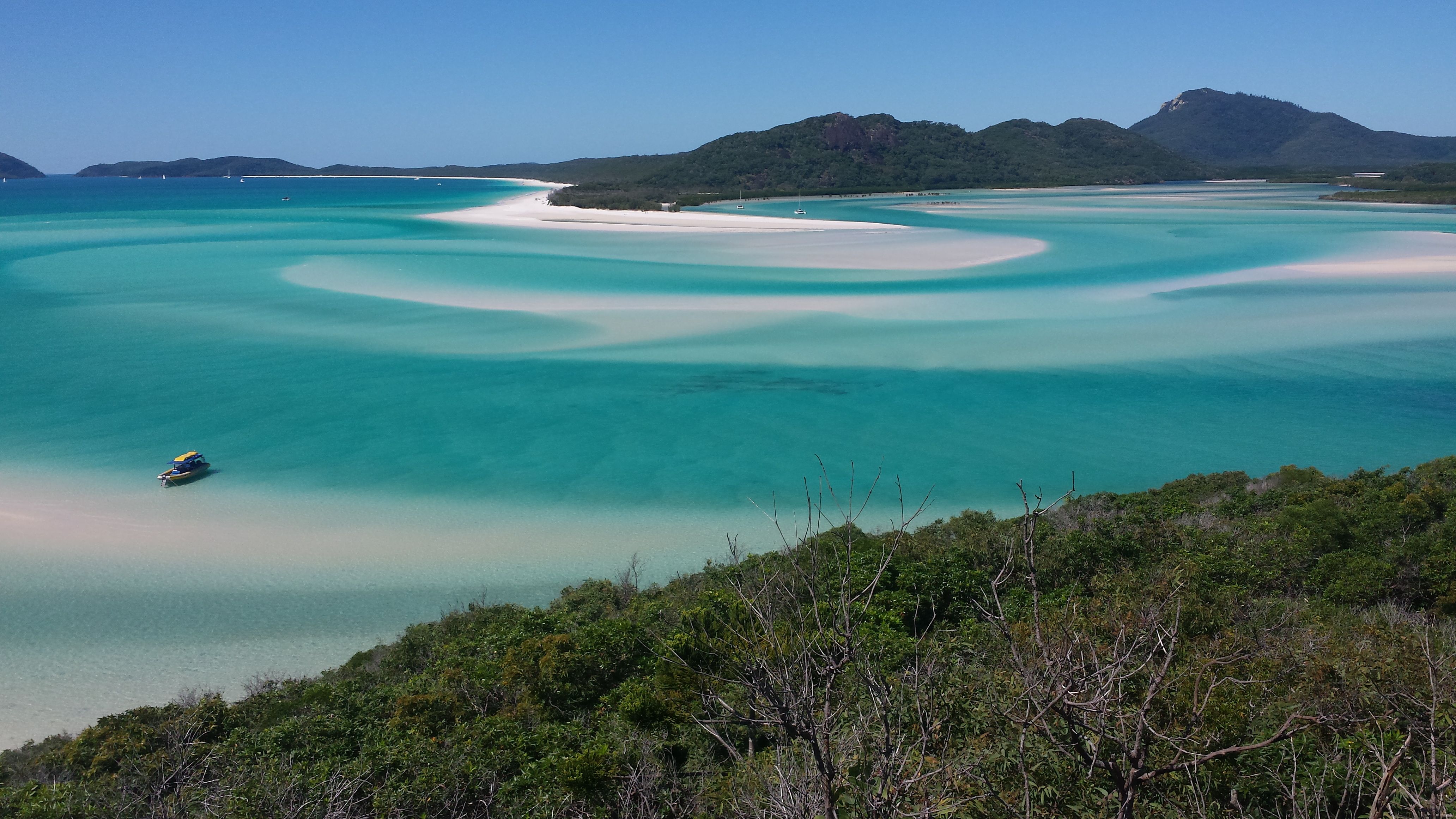 Panorama of Whitsunday Island in turquoise green waters and green trees in Australia, Oceania. 