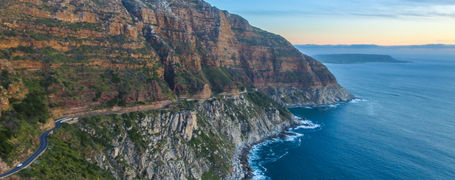 Panorama view of green rocky cape point in South Africa.