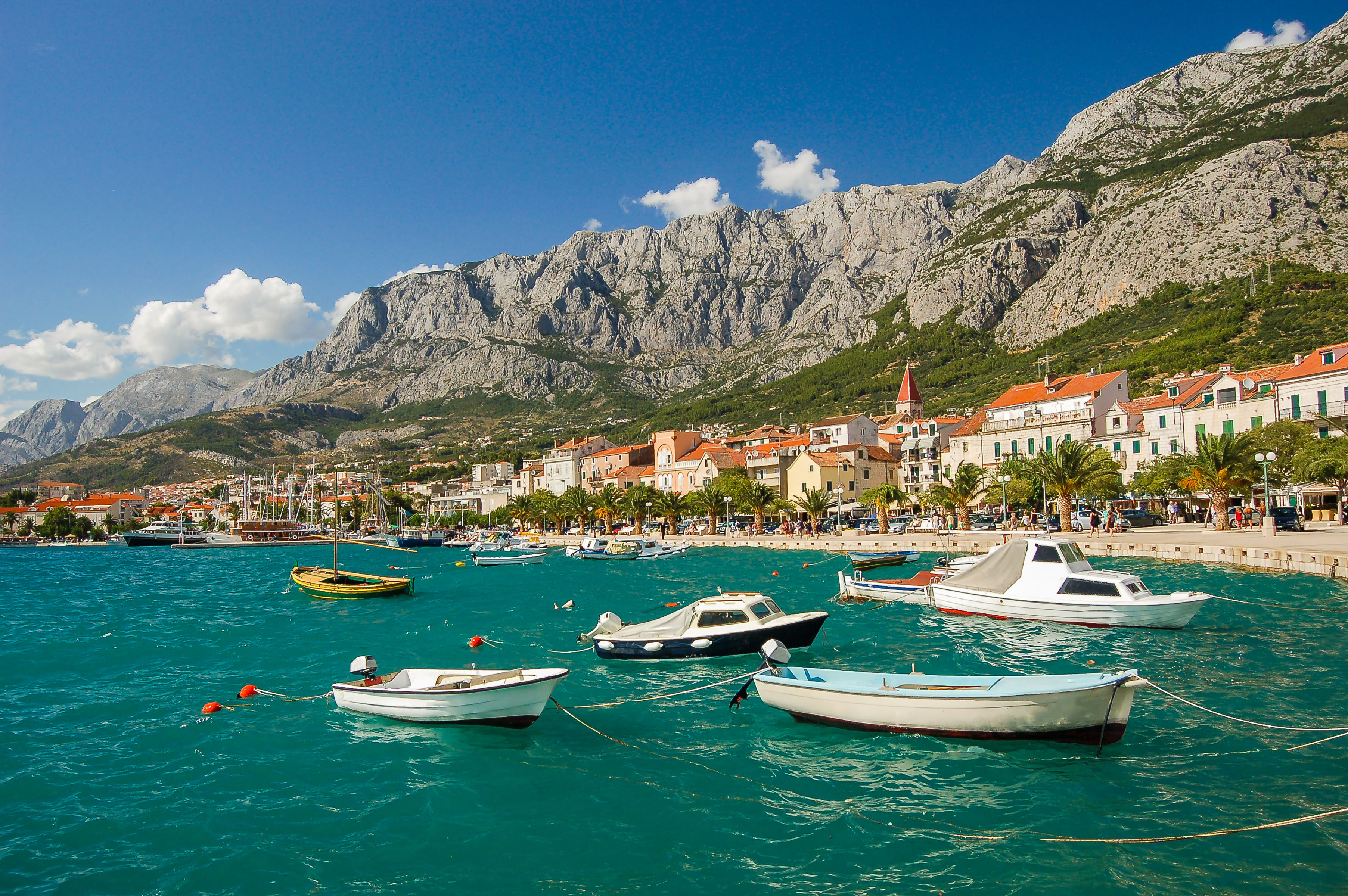 Boats in the water, under the mountain backdrop of Makarska